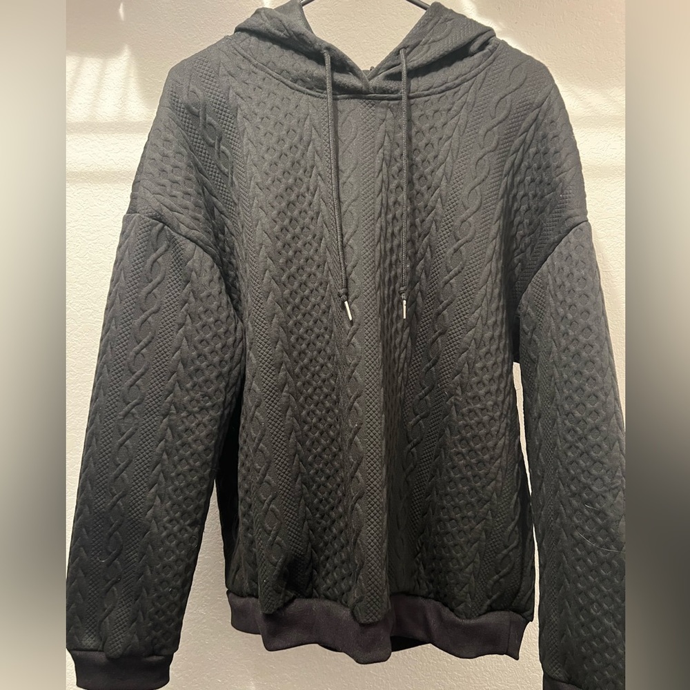 Black textured hoodie.